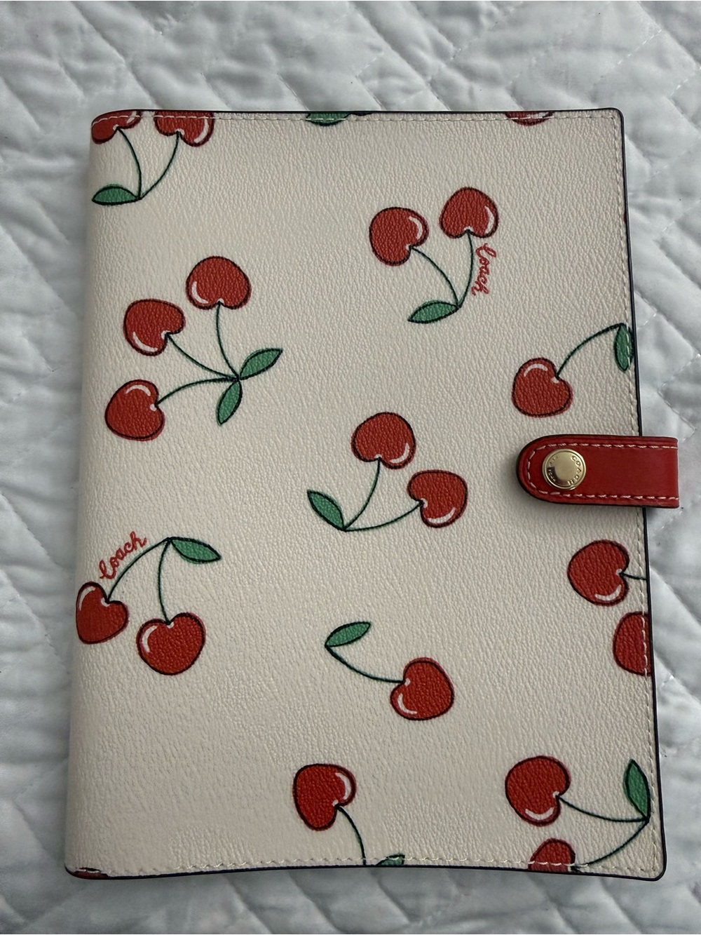 Coach cherry print notebook cover